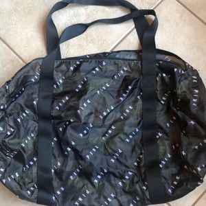 Dark green and black camo duffle bag